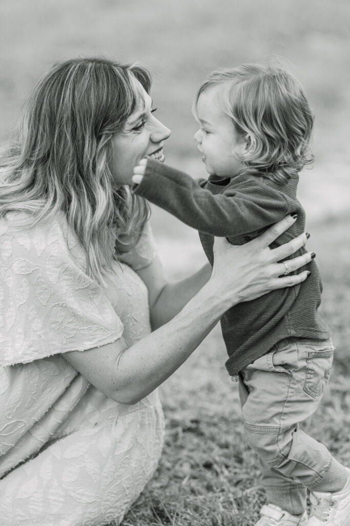 mom snuggling with her toddler son during a family session in east texas